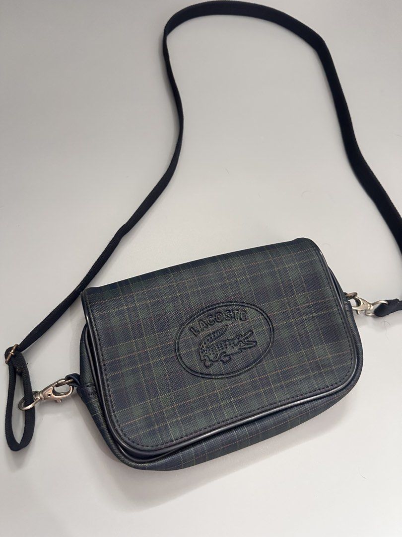 Lacoste Sling Bag (Category: Activewear) located in Manila. Submitted by thriftavenueph (Listing ID 1468725295, Image 1). Description: Fs: Lacoste Sling Bag Condition: excellent, no cracks, no stain, no holes, working all magnet and zippers Price: 3,500.