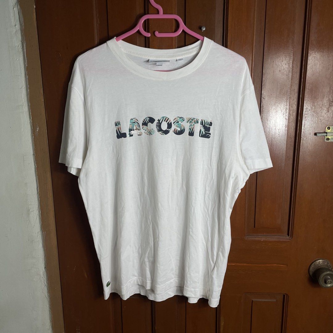 Lacoste spell out floral tee (Category: Activewear) located in Urdaneta. Submitted by northdrops_asian (Listing ID 1468885846, Image 1). Description: Excellent condition .