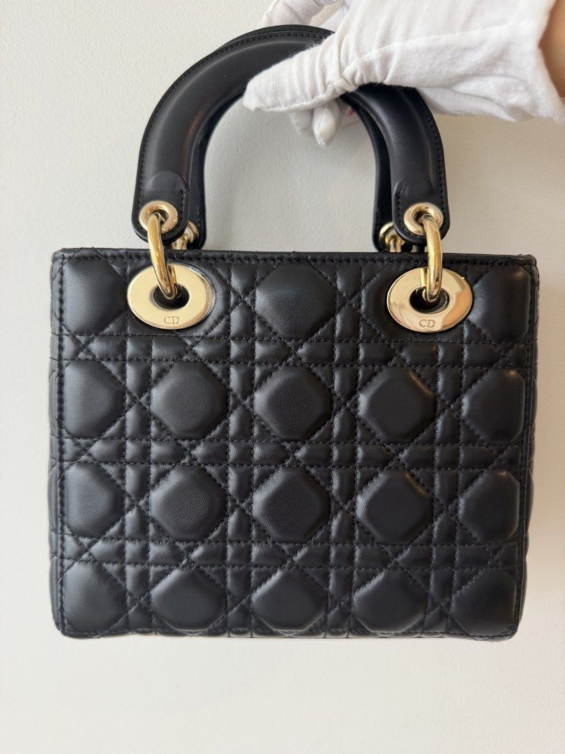 LADY DIOR BLACK SMALL (Category: Luxury Bags & Wallets) located in Makati City. Submitted by theladyluxxe (Listing ID 1468743104, Image 3). Description: 𝐎𝐍 𝐇𝐀𝐍𝐃 ✨ LADY ABCDior SMALL✨ Black with GHW Excellent Condition minimal hairline scratches on hardware Comes with ABC Strap, dust bag & certificate of authenticity Store Price ₱390k 🏷️ 190k for 3mo LA Nego for cash 💳 MOP: BPI/Bank Transfer/Gcash/Maya/Paypal DISCLAIMER: theladyluxxe is NO