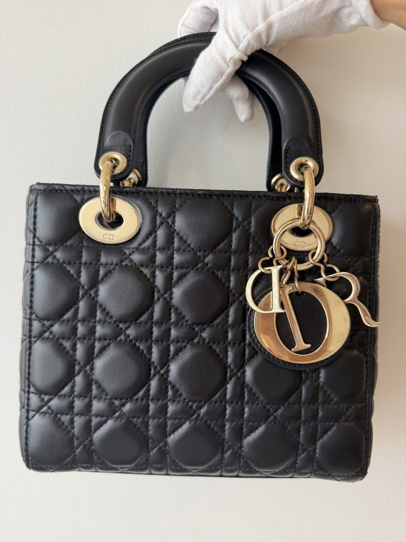 LADY DIOR BLACK SMALL (Category: Luxury Bags & Wallets) located in Makati City. Submitted by theladyluxxe (Listing ID 1468743104, Image 2). Description: 𝐎𝐍 𝐇𝐀𝐍𝐃 ✨ LADY ABCDior SMALL✨ Black with GHW Excellent Condition minimal hairline scratches on hardware Comes with ABC Strap, dust bag & certificate of authenticity Store Price ₱390k 🏷️ 190k for 3mo LA Nego for cash 💳 MOP: BPI/Bank Transfer/Gcash/Maya/Paypal DISCLAIMER: theladyluxxe is NO