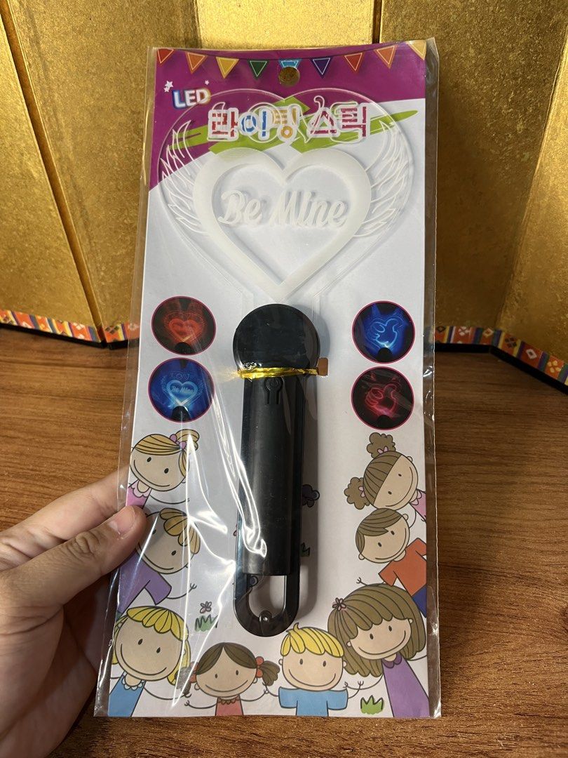 LED Lighting Stick Be Mine Heart Glow Wand (Category: Lighting) located in Gapan. Submitted by lunashop14 (Listing ID 1468715348, Image 1). Description: 4 pcs available sealed - Design: Heart-shaped with "Be Mine" text and angel wings - Lighting: Multicolored flashing LED lights - Size: Approximately 115mm x 250mm - Handle: Black plastic with a convenient hanging loop - Condition: Brand new, sealed in original packaging with Korean product label 
