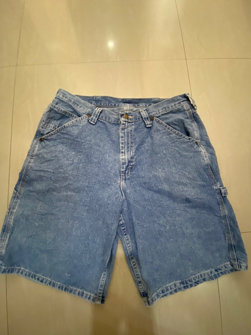 Lee Denim Carpenter Shorts Size 36 Blue (Category: Shorts) located in Vinzons. Submitted by gabrielvic (Listing ID 1468738706, Image 1). Description: - Brand: Lee - Style: Denim carpenter shorts - Size: 36 (Tag inside) - Material: 100% Cotton - Color/Wash: Blue / Medium wash with vintage faded look - Features: Classic multi-pocket design, tool loops, side hammer loop, and signature woven back pocket patch - Closure: Button fly with Lee branding s