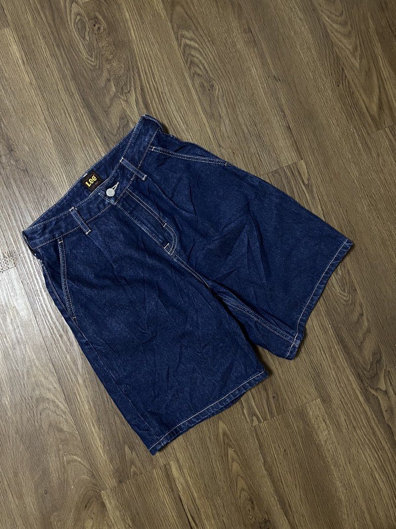 Lee Denim Shorts Size 25 (Category: Shorts) located in Davao. Submitted by znerol_26 (Listing ID 1468829268, Image 3). Description: - Brand: Lee - Style: Classic five-pocket denim shorts - Size: 25 (tag attached) - Color/Wash: Dark blue / dark indigo - Material: 99% cotton, 1% other fiber - Details: Contrast stitching, branded button closure, and leather patch on back waistband.