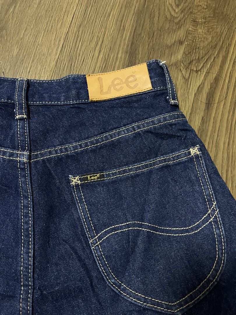 Lee Denim Shorts Size 25 (Category: Shorts) located in Davao. Submitted by znerol_26 (Listing ID 1468829268, Image 2). Description: - Brand: Lee - Style: Classic five-pocket denim shorts - Size: 25 (tag attached) - Color/Wash: Dark blue / dark indigo - Material: 99% cotton, 1% other fiber - Details: Contrast stitching, branded button closure, and leather patch on back waistband.