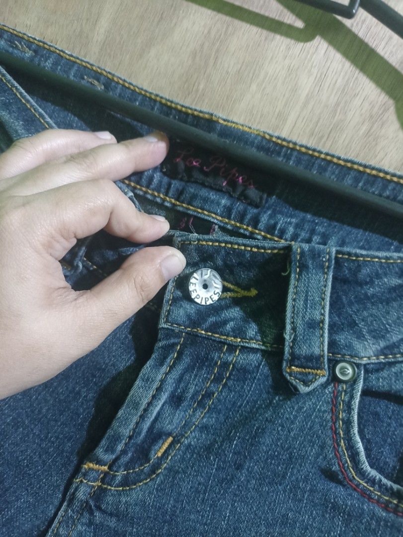 Lee Pipes 08 Denim Jeans flared (Category: Undergarments & Loungewear) located in Tarlac. Submitted by allinoneshop2178 (Listing ID 1468741205, Image 2). Description: - Brand/Model: Lee Pipes 08 bootcut jeans - Color/Wash: Classic blue wash with subtle fading - Waist: Mid-rise with button closure and belt loops - Pockets: Distinctive back pocket stitching with secure flap closures - Size: Tagged 27 x 35.5 - Condition: Great quality classic denim 