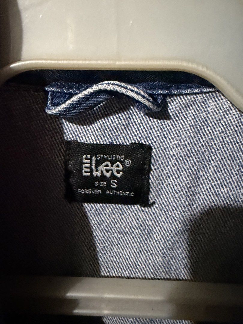 Lee Stylistic Denim Jacket Size S (Category: Coats, Jackets and Outerwear) located in Antipolo. Submitted by joyeduarte175 (Listing ID 1468823952, Image 3). Description: - Brand/Model: Lee Denim Jacket - Wash: Classic blue wash with heavy distressing and fading - Size: Small - Material: Sturdy cotton denim - Features: Button-up front, dual chest flap pockets, side welt pockets, and buttoned cuffs - Fit/Style: Great layering piece with a worn-in v