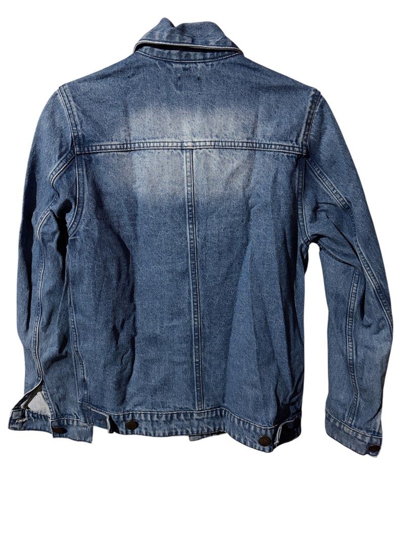 Lee Stylistic Denim Jacket Size S (Category: Coats, Jackets and Outerwear) located in Antipolo. Submitted by joyeduarte175 (Listing ID 1468823952, Image 2). Description: - Brand/Model: Lee Denim Jacket - Wash: Classic blue wash with heavy distressing and fading - Size: Small - Material: Sturdy cotton denim - Features: Button-up front, dual chest flap pockets, side welt pockets, and buttoned cuffs - Fit/Style: Great layering piece with a worn-in v