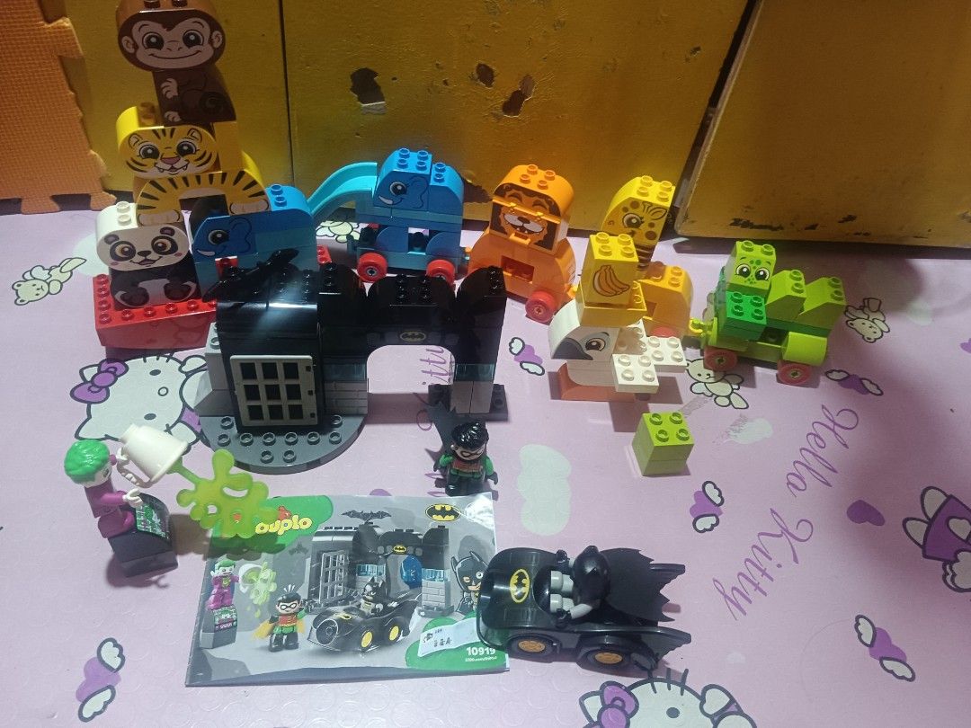 Lego duplo (Category: Lego & Building Sets) located in Pasig City. Submitted by rednaxela_rich (Listing ID 1468730069, Image 1). Description: Lego duplo 4set with container 1) Lego duplo 10884 my first balancing animal 2) Lego duplo 10863 my first animal brick box 3) Lego duplo 10919 bat cave figure & parts batman robin joker batmobile jail 4)Lego duplo toy story train 10894 missing buzz lighter.