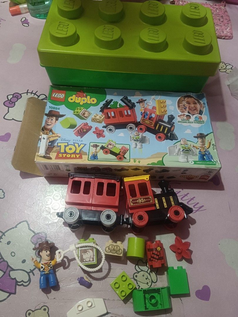Lego duplo (Category: Lego & Building Sets) located in Pasig City. Submitted by rednaxela_rich (Listing ID 1468730069, Image 2). Description: Lego duplo 4set with container 1) Lego duplo 10884 my first balancing animal 2) Lego duplo 10863 my first animal brick box 3) Lego duplo 10919 bat cave figure & parts batman robin joker batmobile jail 4)Lego duplo toy story train 10894 missing buzz lighter.