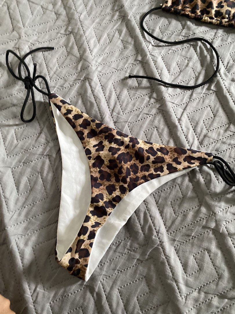 Leopard Print Bikini Set Two Piece Swimwear (Category: Bikinis & Swimsuits) located in Manila. Submitted by newkkmora98454 (Listing ID 1468751519, Image 2). Description: - Leopard print bikini set (top and bottom included) - Triangle top with adjustable black string ties - Matching leopard print bottoms with solid white lining - Adjustable side ties for a custom, comfortable fit - Ideal for swimming, beach days, and vacations.