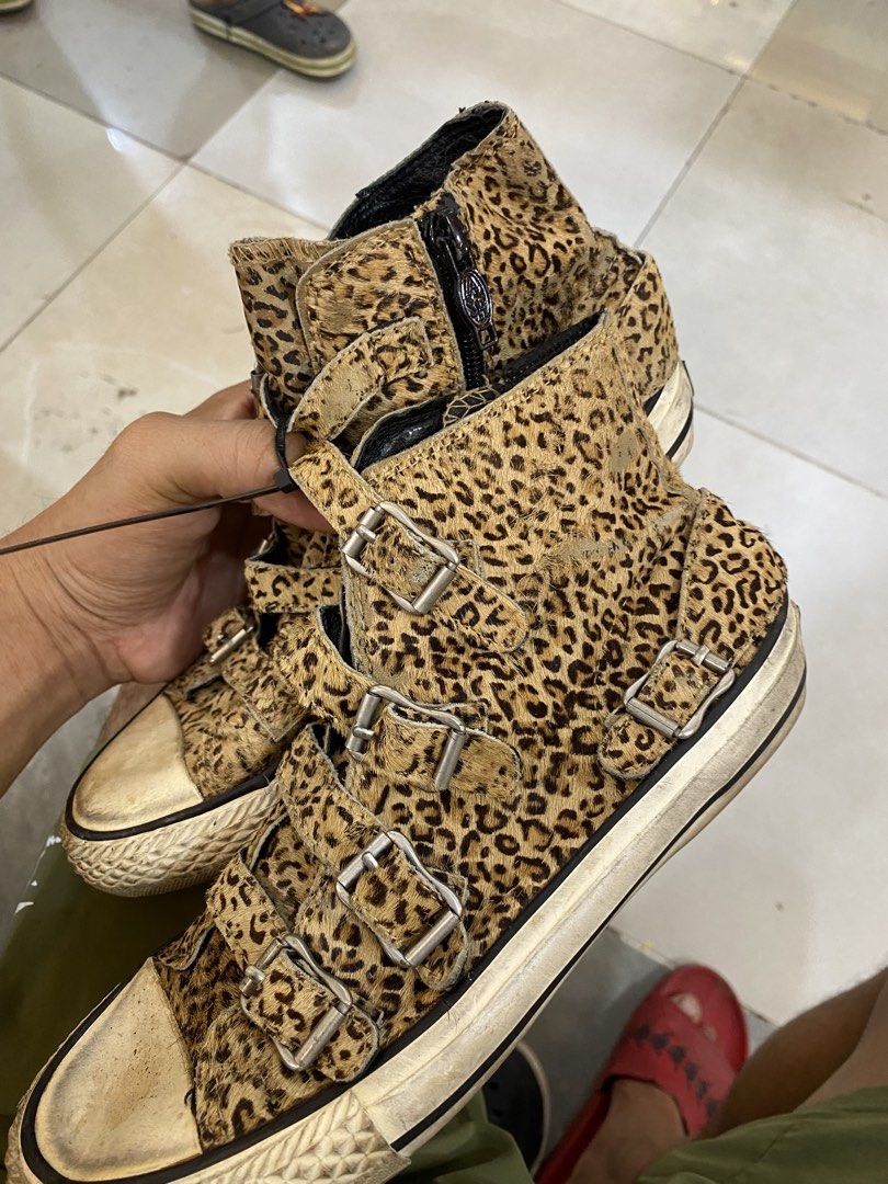 Leopard Print High Top Sneakers With Buckles (Category: Sneakers) located in Alburquerque. Submitted by zanegavynn43872 (Listing ID 1468721077, Image 2). Description: - Trendy leopard print pony hair upper - Multiple front strap closures with silver buckles - Back heel zipper for easy wear - Textured rubber toe cap and midsole - Note: Noticeable wear on soles and yellowing on the white rubber parts.
