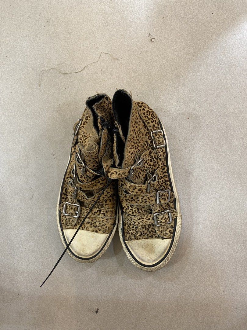 Leopard Print High Top Sneakers With Buckles (Category: Sneakers) located in Alburquerque. Submitted by zanegavynn43872 (Listing ID 1468721077, Image 3). Description: - Trendy leopard print pony hair upper - Multiple front strap closures with silver buckles - Back heel zipper for easy wear - Textured rubber toe cap and midsole - Note: Noticeable wear on soles and yellowing on the white rubber parts.