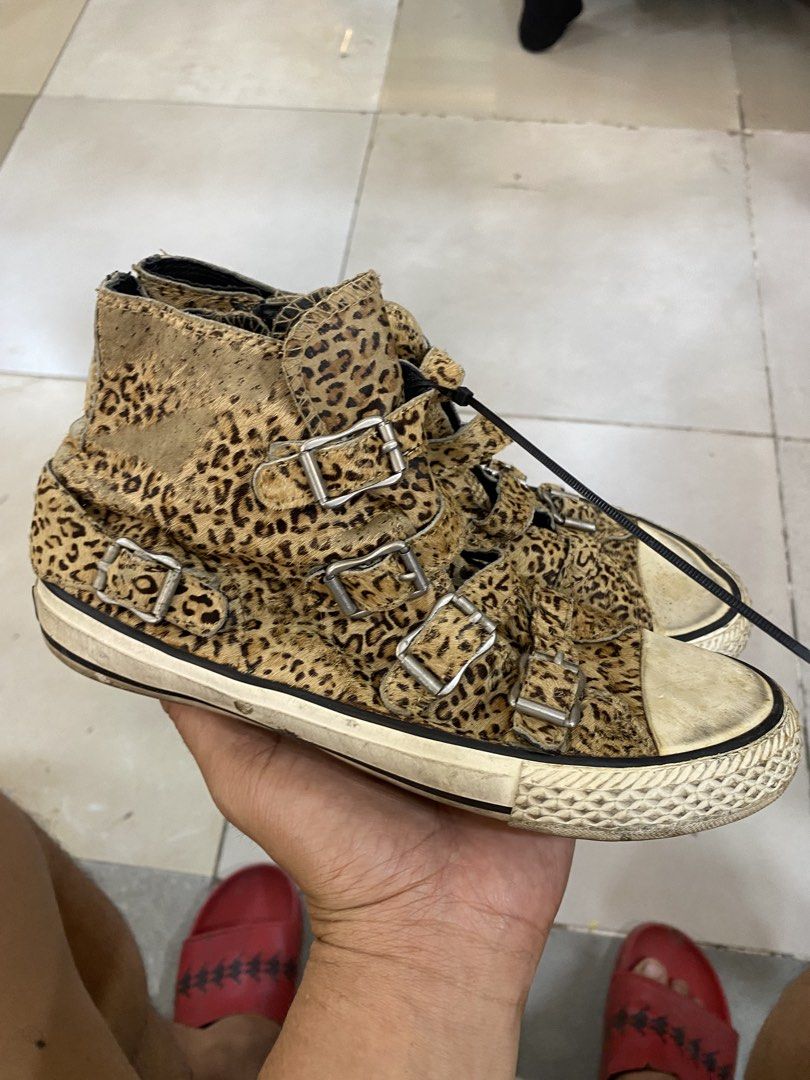 Leopard Print High Top Sneakers With Buckles (Category: Sneakers) located in Alburquerque. Submitted by zanegavynn43872 (Listing ID 1468721077, Image 1). Description: - Trendy leopard print pony hair upper - Multiple front strap closures with silver buckles - Back heel zipper for easy wear - Textured rubber toe cap and midsole - Note: Noticeable wear on soles and yellowing on the white rubber parts.