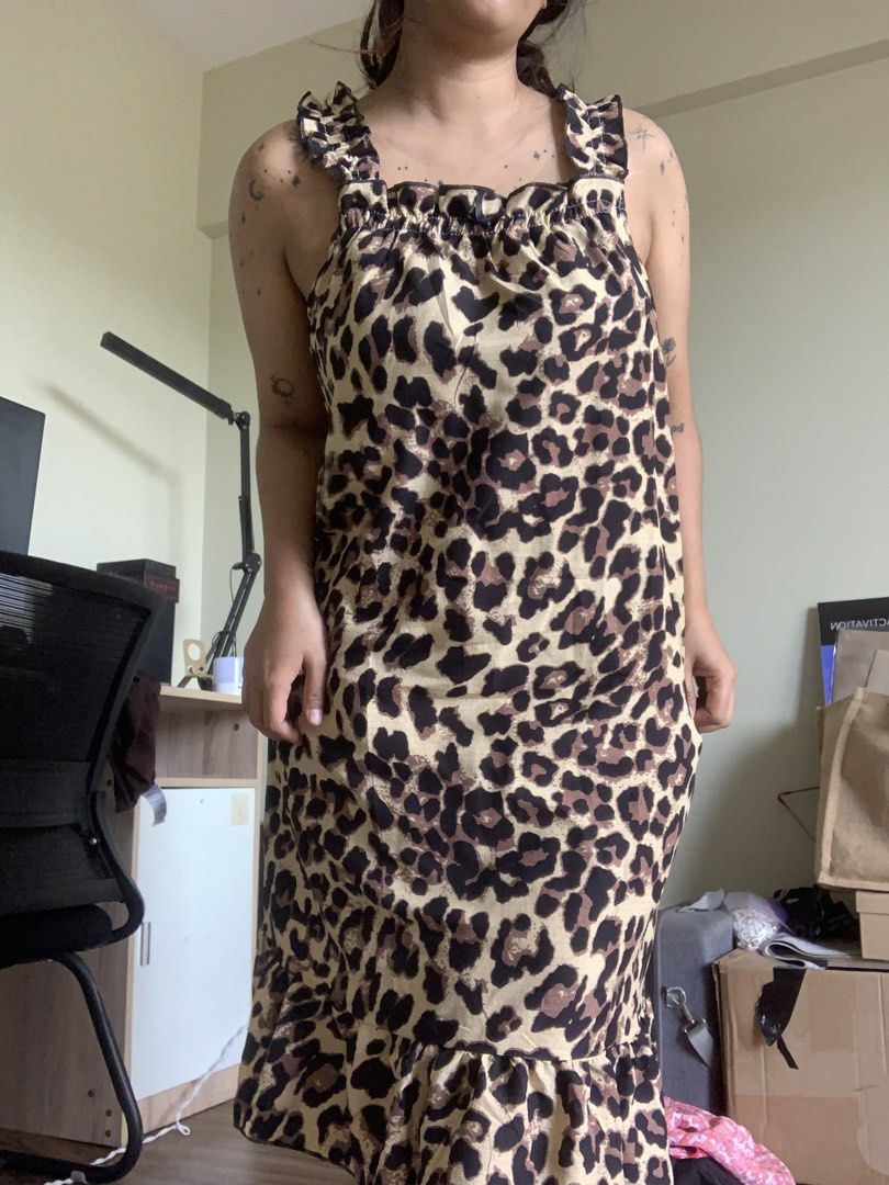 Leopard Print Ruffle Strap Midi Dress (Category: Dresses) located in Antipolo. Submitted by Sparkle111 (Listing ID 1468715509, Image 2). Description: - Trendy cream and black leopard print design - Ruffle shoulder straps and gathered neckline - Flouncy ruffle hem for a playful touch - Relaxed, easy slip-on fit - Perfect for casual outings and warm weather.