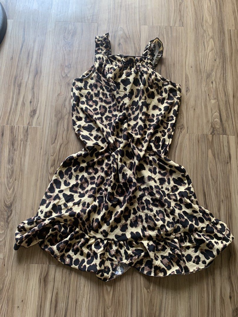 Leopard Print Ruffle Strap Midi Dress (Category: Dresses) located in Antipolo. Submitted by Sparkle111 (Listing ID 1468715509, Image 3). Description: - Trendy cream and black leopard print design - Ruffle shoulder straps and gathered neckline - Flouncy ruffle hem for a playful touch - Relaxed, easy slip-on fit - Perfect for casual outings and warm weather.