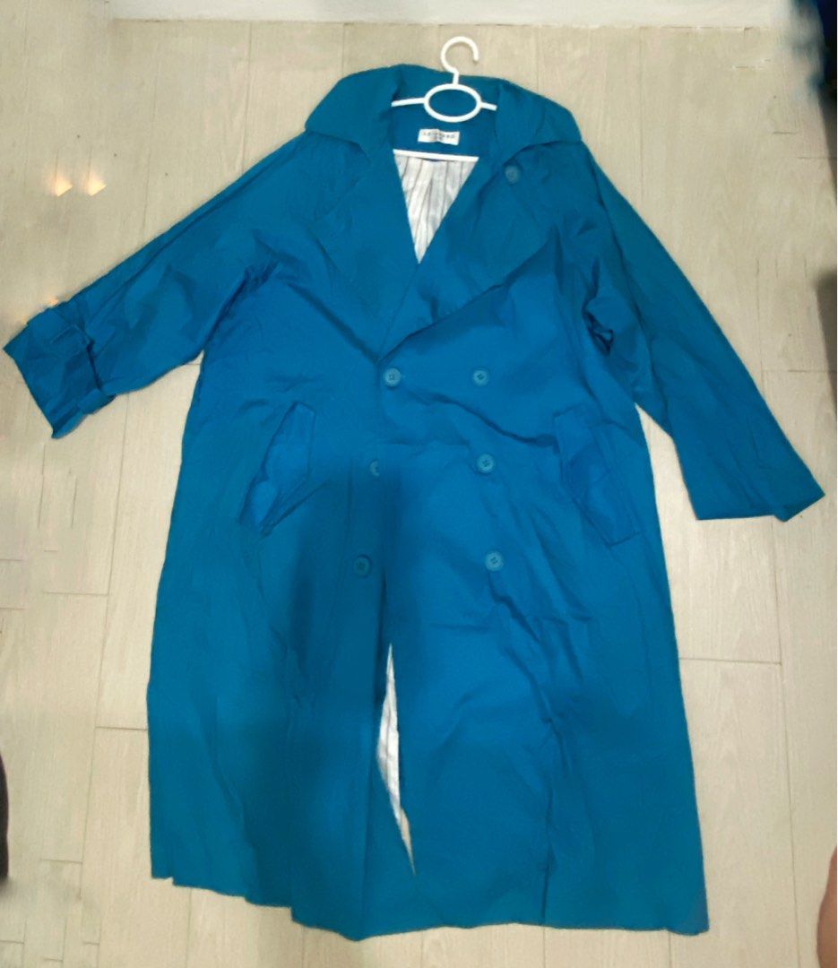 LE-SHERO Bright Blue Double Breasted Trench Coat (Category: Coats, Jackets and Outerwear) located in Manila. Submitted by abbyyey (Listing ID 1468773239, Image 2). Description: - Brand: Le-Shero - Color: Bright blue - Style: Double-breasted trench coat with lapel collar and front buttons - Features: Deep side pockets, long sleeves with cuff strap details - Lining: White fabric with thin grey vertical stripes - Fit: Roomy enough for layering over 