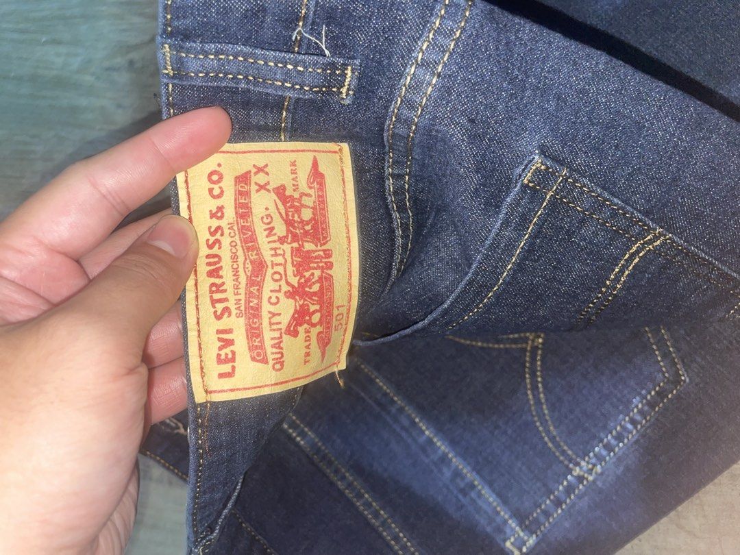 Levi's 501 Dark Blue Jeans Size 34 (Category: Jeans) located in Caloocan City. Submitted by grandhawk-a3f0a4 (Listing ID 1468882139, Image 3). Description: - Brand: Levi's - Style: Classic 501 Straight Leg - Color: Dark Blue Denim with Contrast Stitching - Size: 34 (tag inside pocket) - Details: Button fly closure and signature paper waist patch - Condition: Sturdy fabric, clean hems, well-maintained.