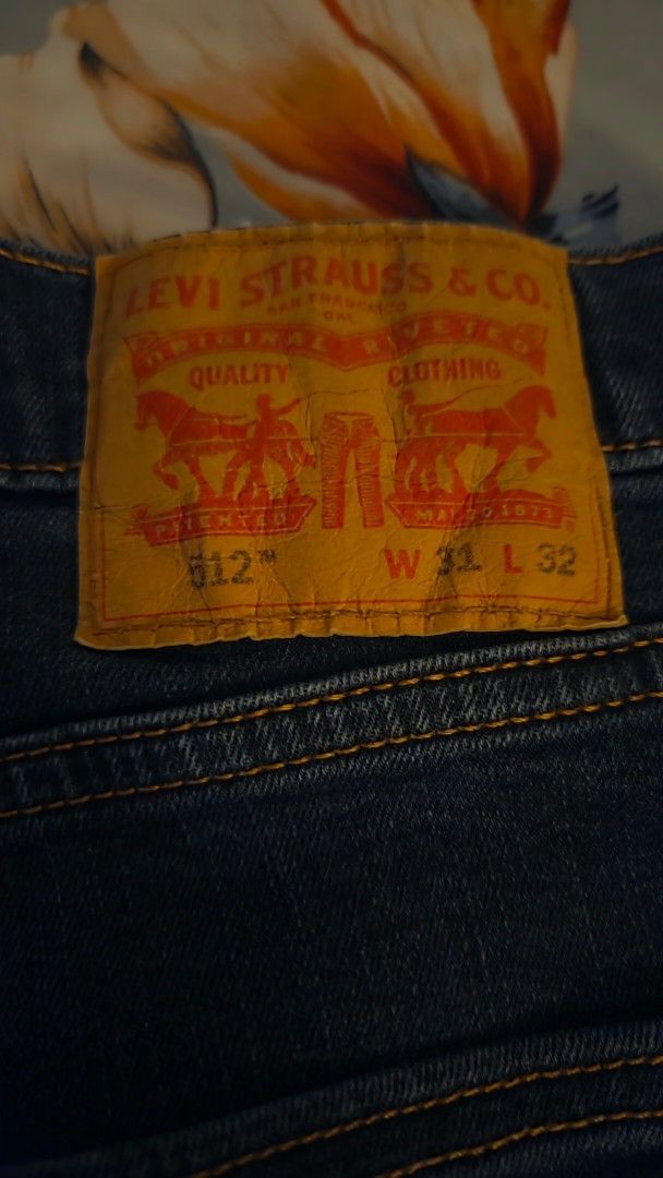 Levi's 512 Jeans W32 L32 (Category: Jeans) located in Manila. Submitted by bernadette2207 (Listing ID 1468762652, Image 1). Description: - Brand: Levi's 512 - Size: W32 L32 - Color: Dark wash blue - Fit: Straight leg - Details: Classic five-pocket style, contrast stitching, metal button fly closure, signature red tab, and leather back waist patch - Condition: Excellent, well-maintained - Mode of Payment: GCash, BPI, or Bank Transfer - Shipping: S