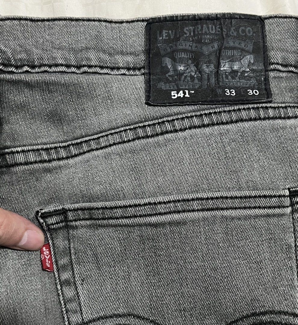 Levi's 541 Athletic Fit Jeans Grey (Category: Jeans) located in Manila. Submitted by chococoffeeboy (Listing ID 1468843029, Image 1). Description: Levi's 541 Gray Athletic Fit Waist 34” Length 38.5” Hem 7.5” - Color: Grey with slight fading - Material: Waterless denim collection (Made in Pakistan) - Details: Classic 5-pocket styling, zip fly, button closure, leather back patch, and iconic red tab - Condition: Pre-owned with minor, natural fading 