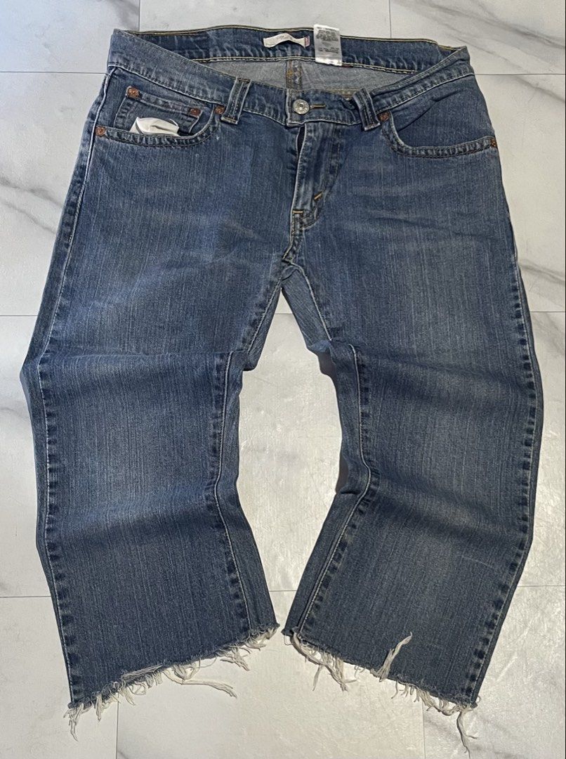 Levi's 542 Low Flare Jeans Size 12M (Category: Jeans) located in Cavite. Submitted by christianzuuu (Listing ID 1468767041, Image 1). Description: Levi's 542 low flare jeans in medium blue wash. Size 12M on tag, with laid-flat measurements handwritten on tape across the back pocket: waist 17 inches, length 32 inches, leg opening 10.5 inches. Button fly closure. Flap pockets on the back with button details. Raw frayed hems at the bottom. 99 percen
