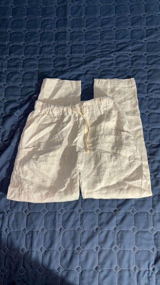Light beige linen drawstring trousers casual pants (Category: Jeans) located in Manila. Submitted by itz_zy (Listing ID 1468857573, Image 1). Description: - Color: Light beige - Material: Breathable linen, perfect for warm days - Fit: Relaxed, straight leg cut - Waistband: Elastic with a matching adjustable drawstring - Pockets: Two functional side pockets.