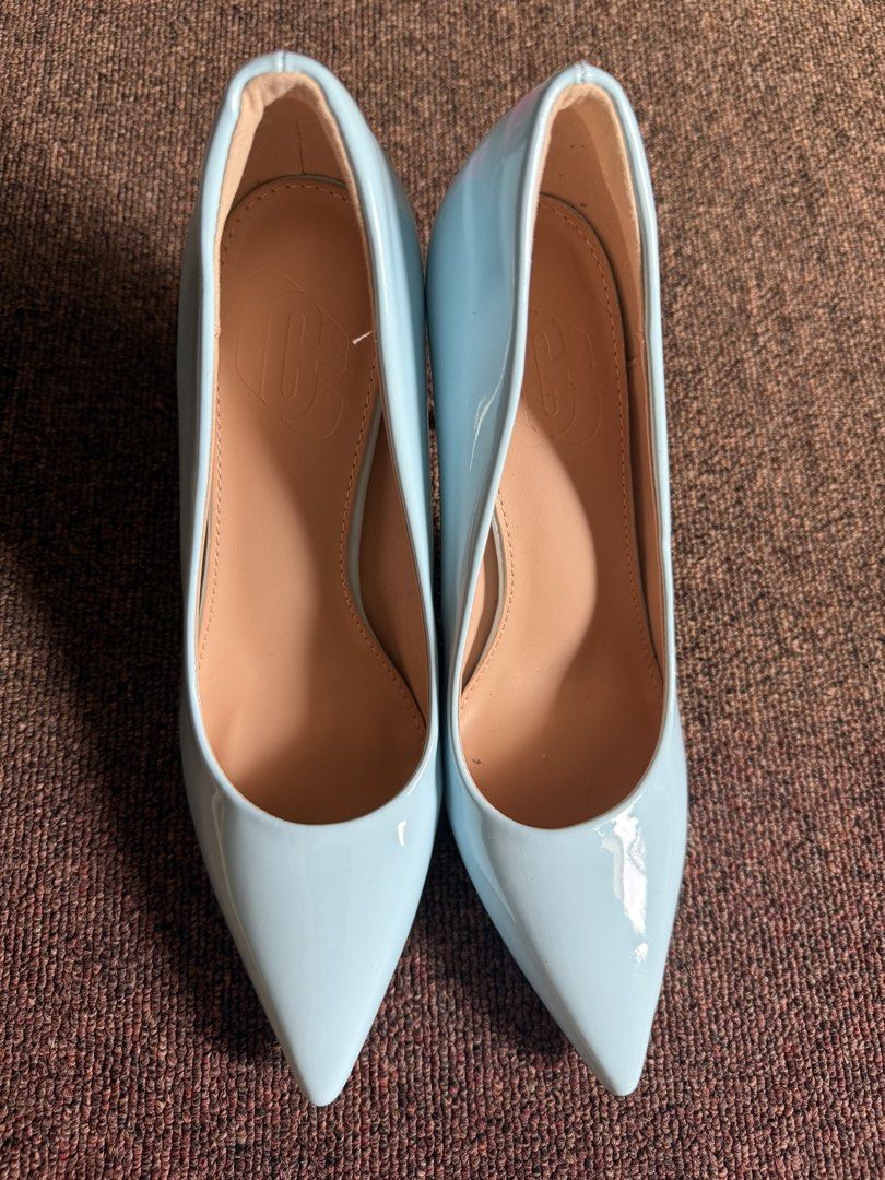 Light Blue Patent Pointed Toe Stiletto Heels Size 38 (Category: Heels) located in Cagayan de Oro. Submitted by redbluerider (Listing ID 1468779159, Image 1). Description: - Style: Pointed toe stiletto high heels - Color: Light blue patent with glossy finish (tan inner lining and sole) - Size: 38 - Condition: Excellent, closet clear-out piece ready for a new owner Price is negotiable.