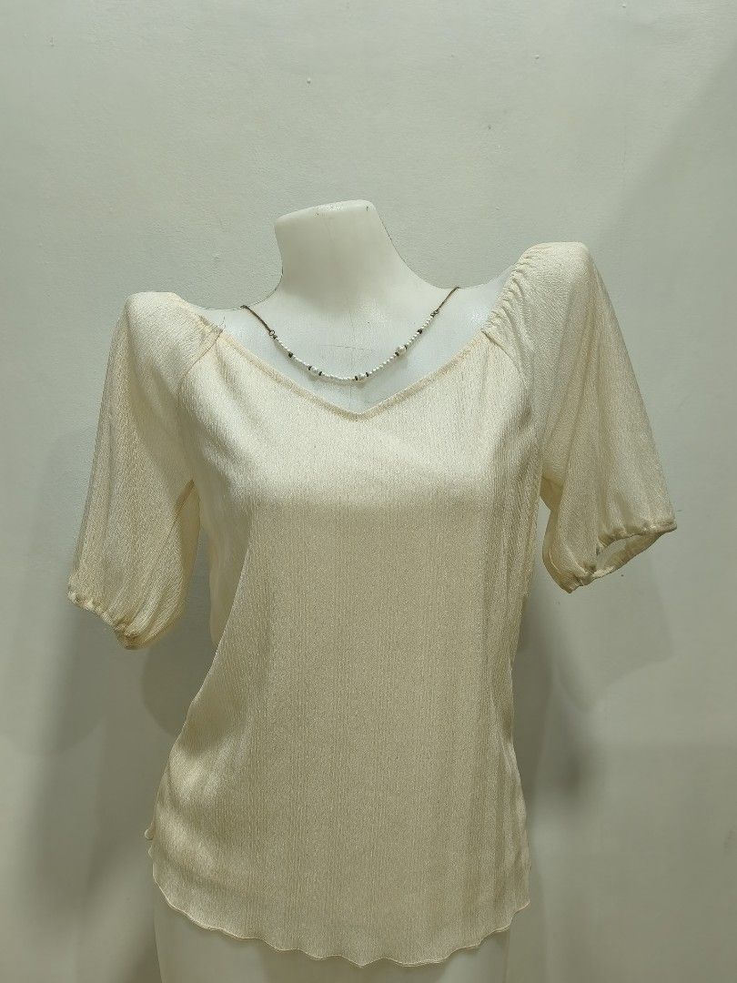Light Champagne V-Cut Double Lining Blouse (Category: Blouses) located in Subic. Submitted by athelstlane (Listing ID 1468850572, Image 1). Description: - Lettuce Hem on the bottom of the blouse - Silk double-lining - Light-weight fabric.