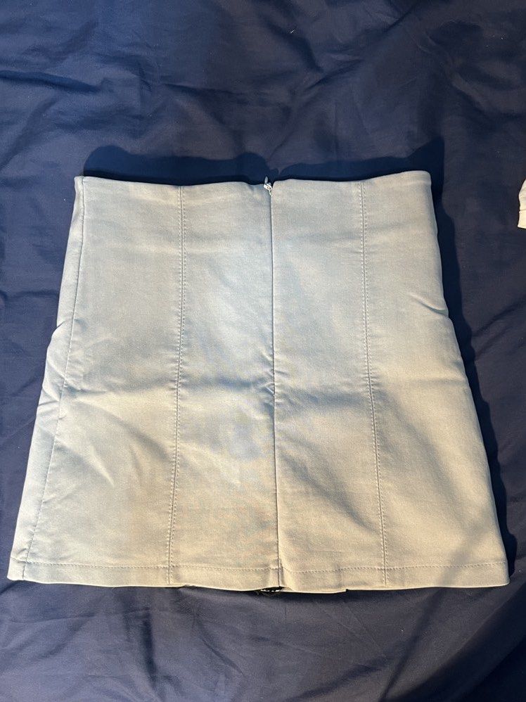 Light Gray Mini Skirt with Inner Shorts (Category: Skirts) located in Marikina City. Submitted by yssacee (Listing ID 1468916052, Image 2). Description: - Polyester Material - Comfort: Built-in black safety shorts for extra coverage - Design: Panel seam detailing on front and back - Closure: Hidden back zipper - Fit: Short mini length - Fits womens xs-s - pm for more photos, photo may vary due to lighting - shipping from lower antipolo rizal - rf