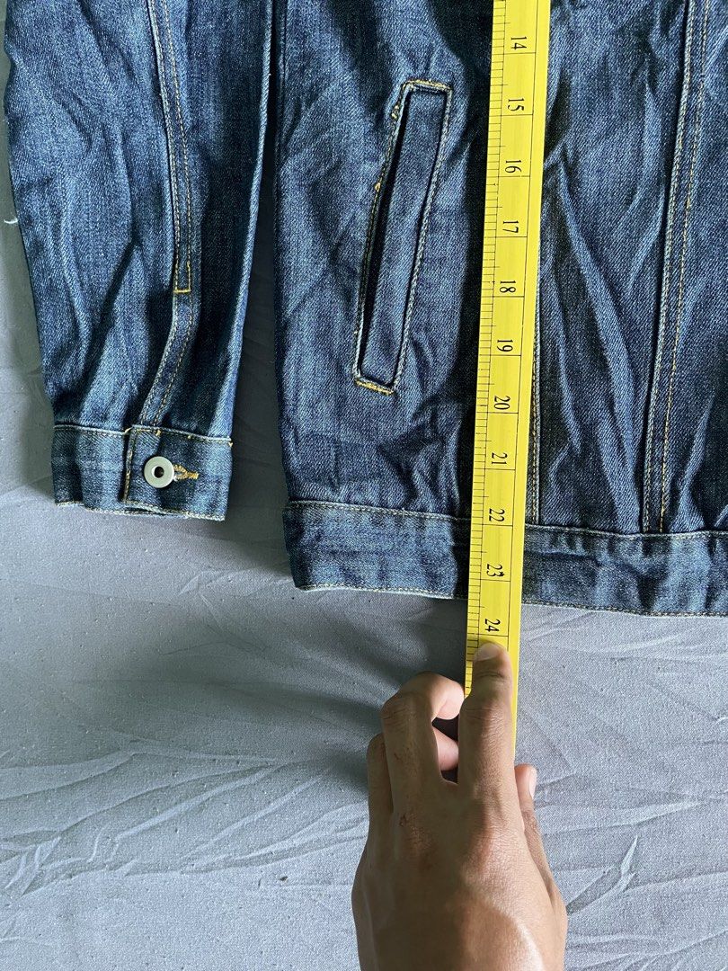 Lindsay Original Authentic Clothing Denim Jacket (Category: Coats, Jackets and Outerwear) located in Cagayan de Oro. Submitted by jekdels05 (Listing ID 1468767381, Image 3). Description: - Brand: Lindsay - Wash: Classic dark wash denim - Details: Contrast stitching with "Lindsay" embroidery and tiny heart on the left chest pocket - Pockets: Button-up front, button-flap chest pockets, and side pockets - Measurements: Width ~21 inches, Length ~24 i