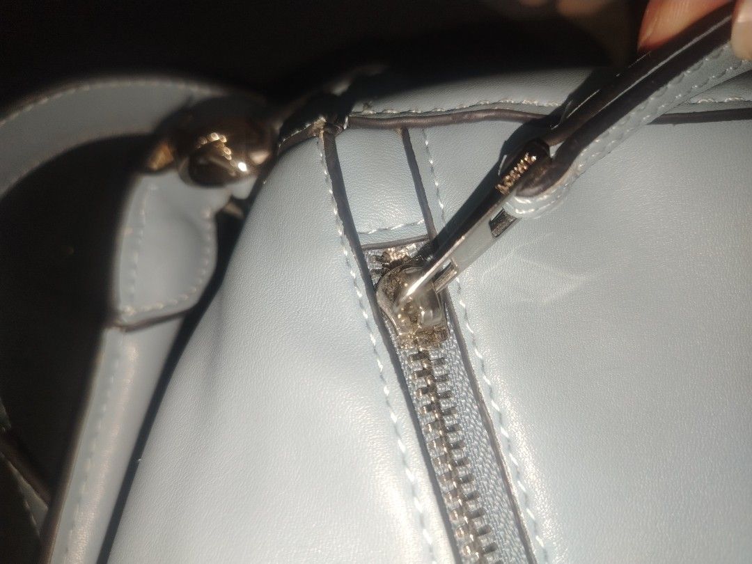 Loewe Puzzle Bag Light Blue (Category: Luxury Bags & Wallets) located in Manila. Submitted by warmwater.788864 (Listing ID 1468784994, Image 3). Description: - Authentic Loewe Puzzle Bag in a gorgeous light blue shade - Iconic geometric panel design with top handle and removable shoulder strap - Silver-tone hardware complete with branded clasps and zip pulls - Luxurious beige herringbone fabric lining with embossed 'Made in Spain' leather tag - I