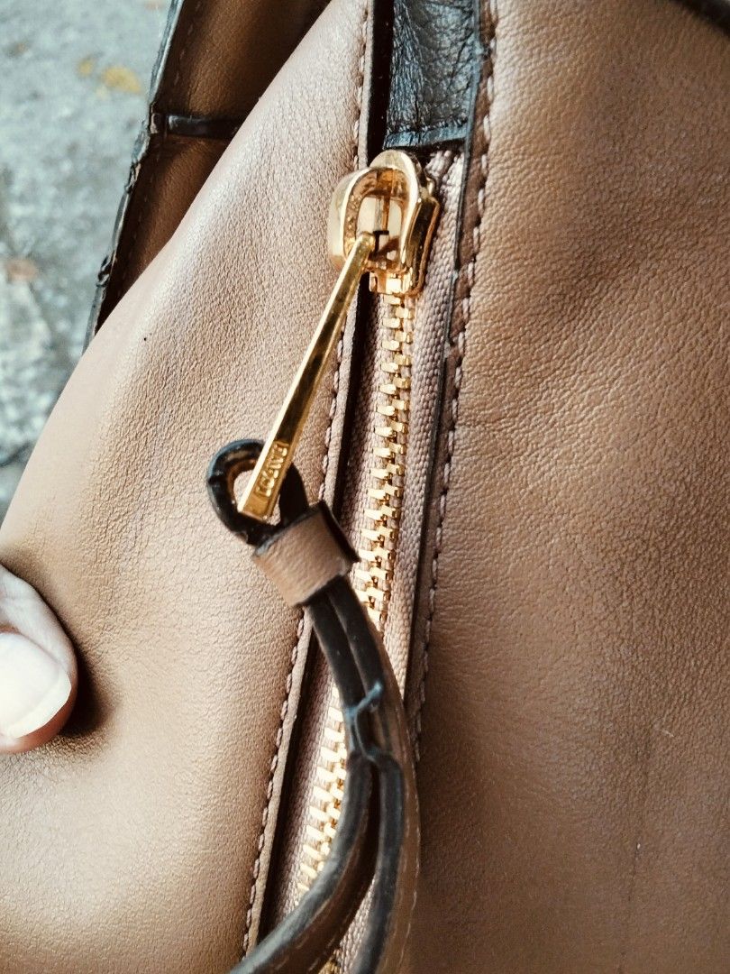 Loewe Puzzle Bag Multi-colour Leather (Category: Luxury Bags & Wallets) located in Tuguegarao City. Submitted by luxthrifttuguegarao (Listing ID 1468766359, Image 3). Description: -Loewe Puzzle bag in a stylish multi-colour leather block design - Features a top handle and a convenient adjustable shoulder strap - Elegant gold-tone hardware with Loewe branding stamps - Interior lined with durable herringbone canvas - Includes 'Made in Spain' tag an