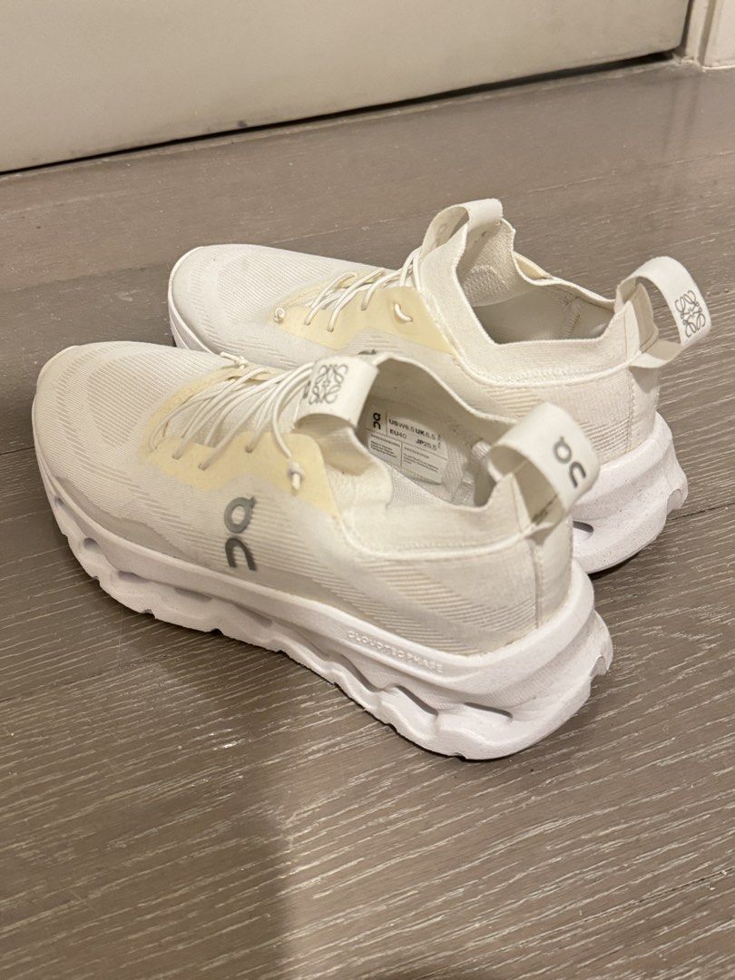 Loewe x On Cloudtilt Phase Sneakers White (Category: Sneakers) located in Pasig City. Submitted by furniture.decultter (Listing ID 1468849288, Image 1). Description: - Item: Loewe x On Cloudtilt Phase Sneakers - Color: Clean White - Size: US W 8.5 / UK 6.5 / EU 40 / JP 25.5 - Features: Lightweight knit upper, chunky CloudTec Phase sole, slip-on collar with speed lacing - Branding: Iconic Loewe anagram on the side and tongue tab - Vibe: Super comf