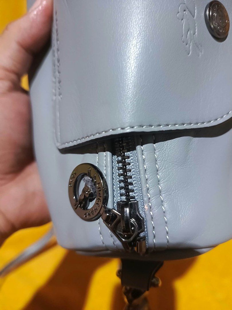 Longchamp Crossbody Bag Leather (Category: Cross-body Bags) located in Cebu City. Submitted by yenetcuba52435 (Listing ID 1468901132, Image 3). Description: - Brand: Longchamp - Material: Premium leather in a gorgeous light blue shade - Closure: Flap with embossed horse logo and snap button - Strap: Adjustable matching shoulder strap - Hardware: Metal zipper pull with Longchamp branding - Authenticity details: Back flap stamped with Longchamp and
