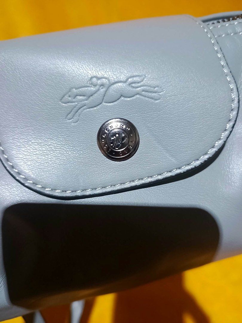 Longchamp Crossbody Bag Leather (Category: Cross-body Bags) located in Cebu City. Submitted by yenetcuba52435 (Listing ID 1468901132, Image 2). Description: - Brand: Longchamp - Material: Premium leather in a gorgeous light blue shade - Closure: Flap with embossed horse logo and snap button - Strap: Adjustable matching shoulder strap - Hardware: Metal zipper pull with Longchamp branding - Authenticity details: Back flap stamped with Longchamp and