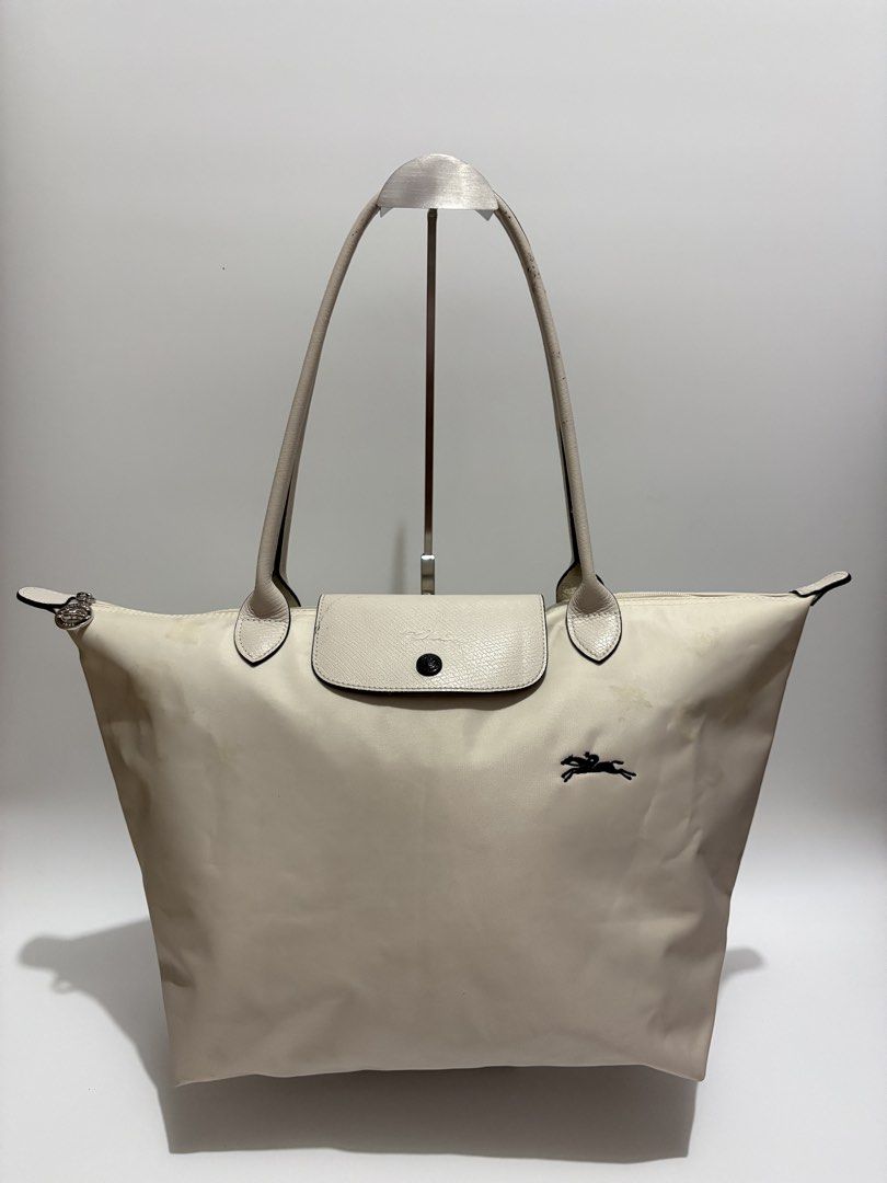 Longchamp Large Long Handle (Category: Luxury Bags & Wallets) located in Subic. Submitted by dear.jeveaph (Listing ID 1468751306, Image 1). Description: Longchamp Le Pliage Large Long Handle Minimal signs of use With patch stains Needs wash ₱ 600.00 READ BEFORE BUYING ‼️ All photos are posted. Please perform your own authentication beforehand. If in DOUBT, please do NOT buy. ‼️ Friendly reminder: This is a preloved bag. Please manage your expecta