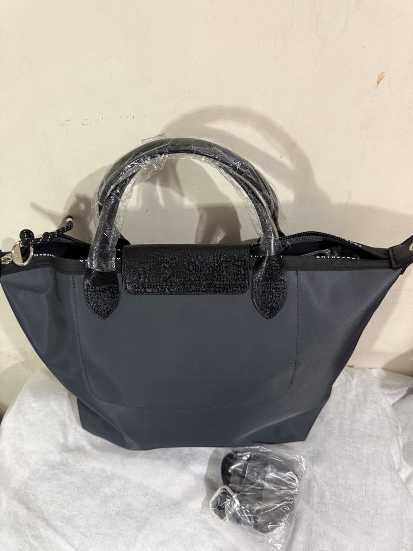 Longchamp Le Pliage Energy (Category: Shoulder Bags) located in Quezon City. Submitted by vluxxe (Listing ID 1468843294, Image 2). Description: Dark gray with detachable shoulder strap Lightweight waterproof material Measurement:See photos .