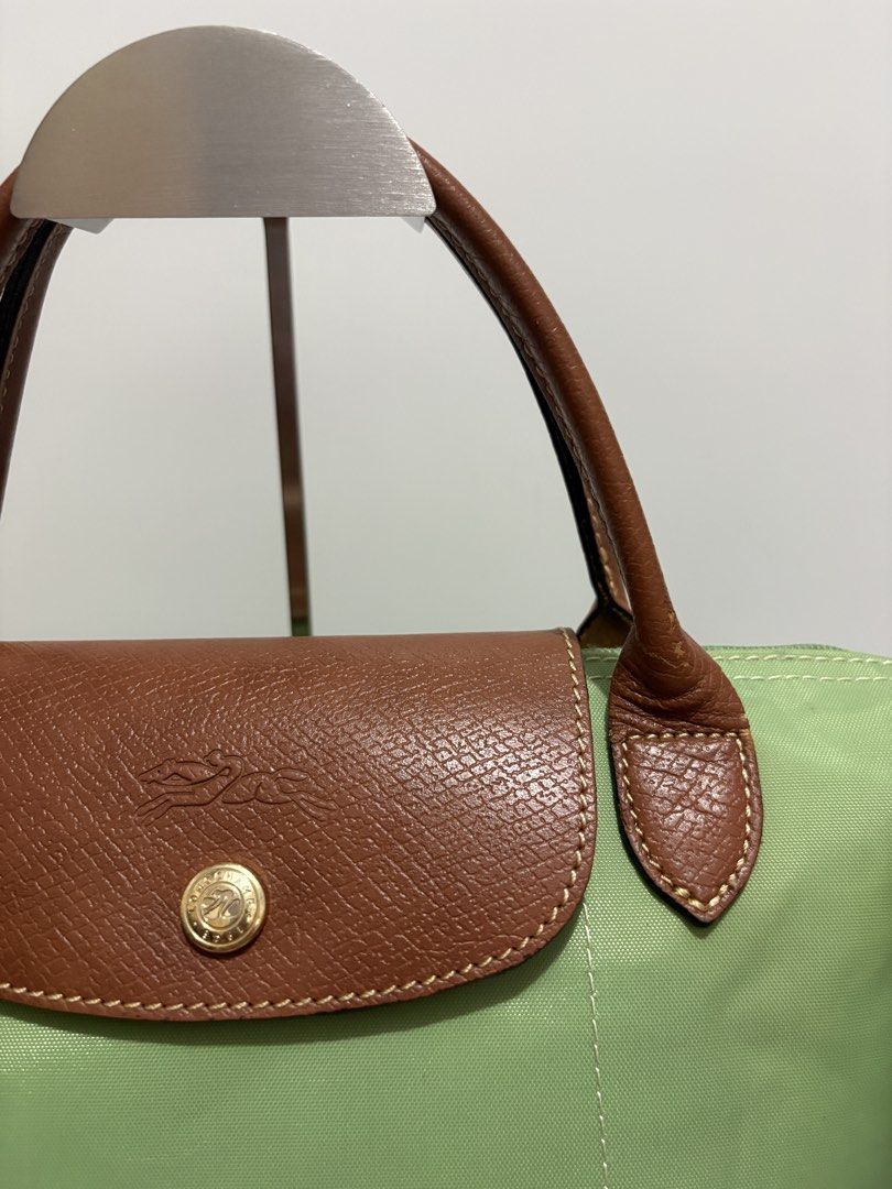 Authentic Longchamp Le Pliage Small Short Handle (Category: Luxury Bags & Wallets) located in Subic. Submitted by dear.jeveaph (Listing ID 1468757819, Image 3). Description: Authentic Longchamp Le Pliage Small Short Handle Minimal signs of use ₱ 1000.00 READ BEFORE BUYING ‼️ All photos are posted. Please perform your own authentication beforehand. If in DOUBT, please do NOT buy. ‼️ Friendly reminder: This is a preloved bag. Please manage your exp