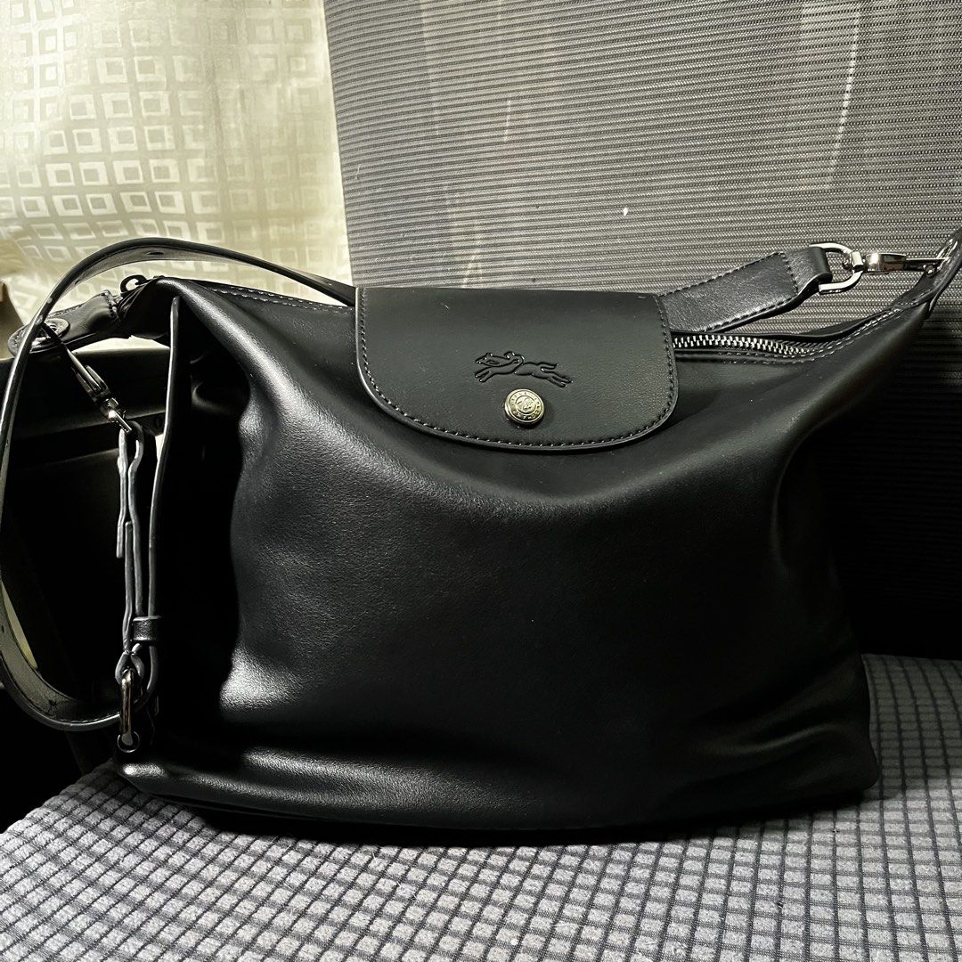 Black Longchamp Medium Le Pliage Adjustable Shoulder Bag (Category: Shoulder Bags) located in Manila. Submitted by fleurnarcotik (Listing ID 1468827219, Image 2). Description: Authentic see serial code Color & Material: Black Calf Leather Dimensions (Official Site): 12.4" (W) x 9.84" (H) x 4.33" (D) Shipping Preferred: Lalamove is highly recommended to preserve the bag's shape during transit. J&T Express is also available, but pouches have size l