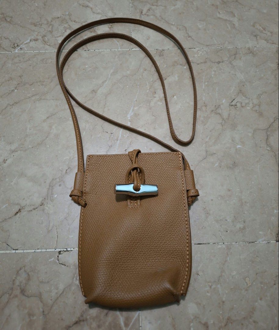 LONGCHAMP PHONE SLING (Category: Luxury Bags & Wallets) located in Manila. Submitted by crestymill (Listing ID 1468929122, Image 1). Description: FOR SALE 💌 LONGCHAMP PHONE SLING 850php.