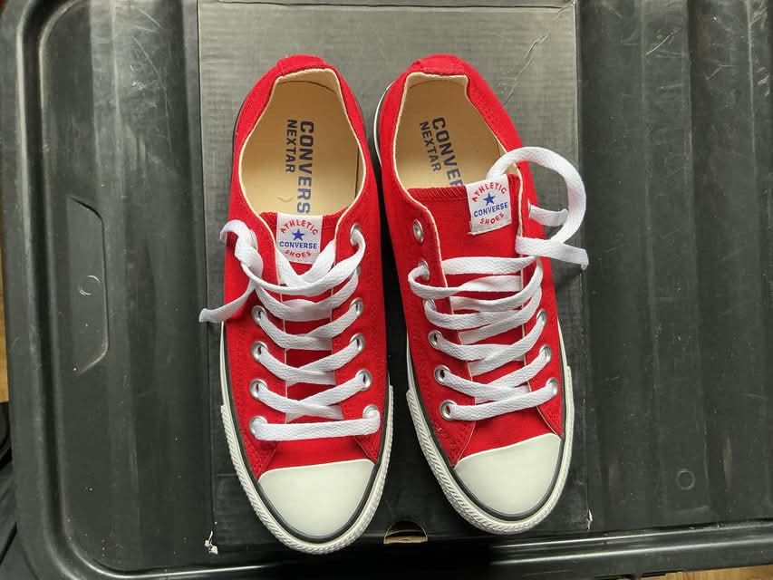 Lot Sneakers (Category: Sneakers) located in Quezon City. Submitted by gabrilloaaaaaaa (Listing ID 1468802813, Image 2). Description: - Brand/Model: Converse Low-Tops - Color: Bright Red with contrast white laces and toe cap - Details: Classic star branding patch on tongue and text prints on insoles - Condition: Clean soles, ready to wear - Style: Casual footwear staple for daily rotation.