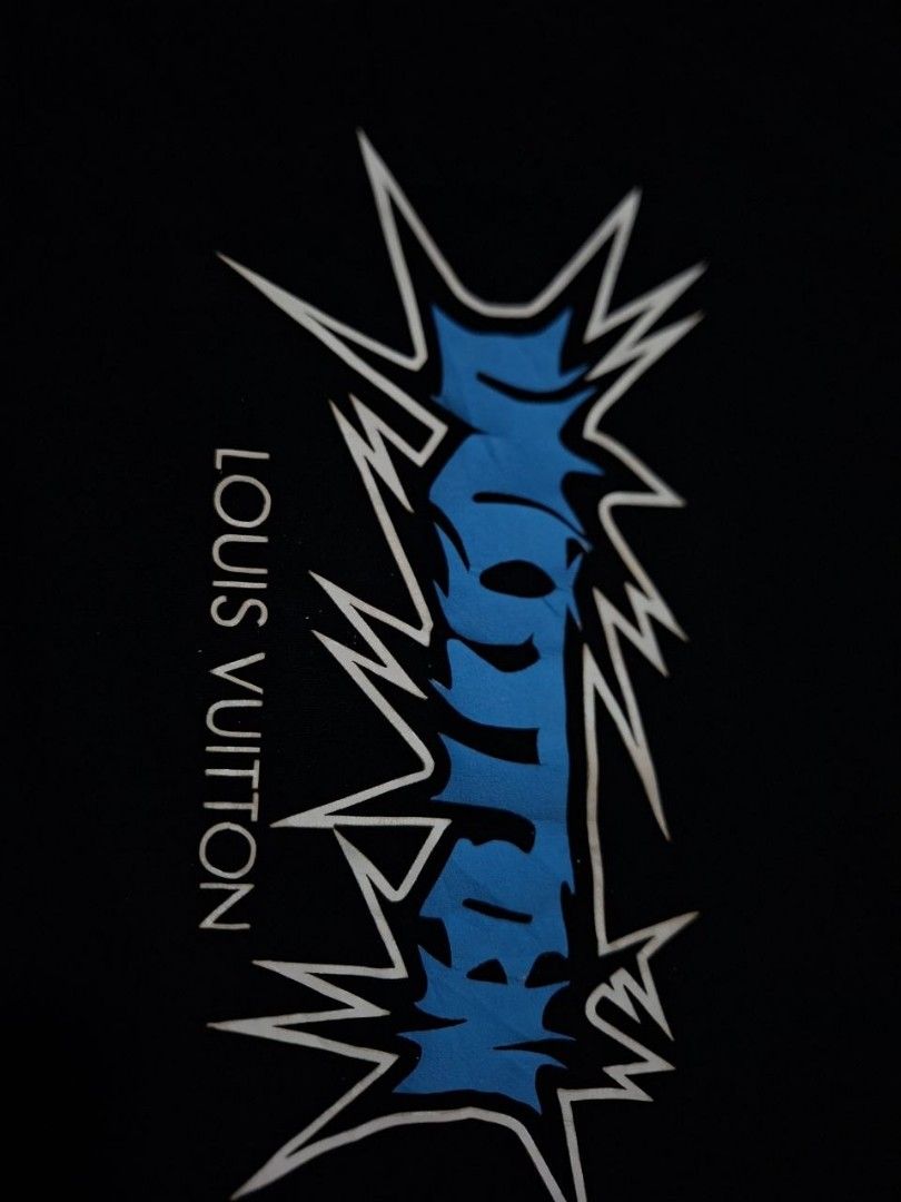 Louis Vuitton Black Graphic T-Shirt (Category: Tshirts & Polo Shirts ) located in Rizal. Submitted by thrifthings_10 (Listing ID 1468880481, Image 2). Description: - Brand: Louis Vuitton - Color: Black - Design: Blue and white lightning graphic print with branding - Material: 100% comfortable cotton - Details: Includes woven neck tag and inner care label - Fit/Style: Casual wear, regular fit - Condition: Good pre-owned condition - PM for inquirie