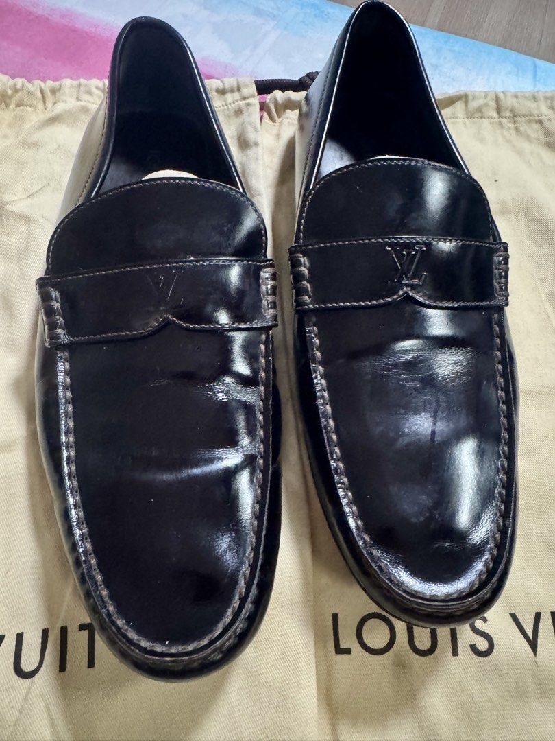 Louis Vuitton Black Leather Loafers Size 7 (Category: Dress Shoes) located in Paranaque City. Submitted by tripleddd151025 (Listing ID 1468738883, Image 1). Description: - Brand: Louis Vuitton - Style: Slip-on driver loafers - Color: Black leather - Size: 7 (stamped inside) - Features: Subtle LV logo on strap, comfortable rubber sole pads - Origin: Made in Italy - Inclusions: Original dust bags included - Condition: Excellent.