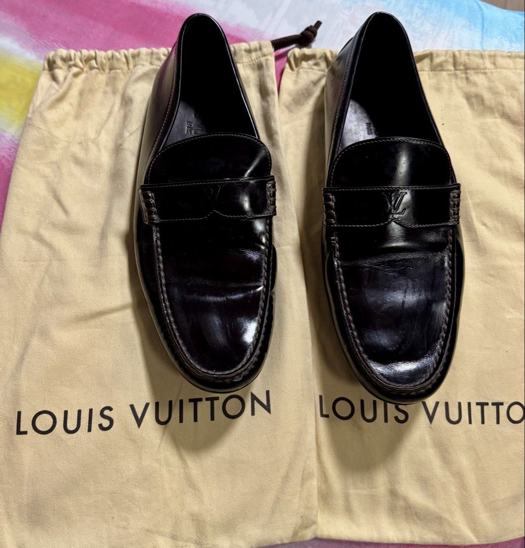 Louis Vuitton Black Leather Loafers Size 7 (Category: Dress Shoes) located in Paranaque City. Submitted by tripleddd151025 (Listing ID 1468738883, Image 2). Description: - Brand: Louis Vuitton - Style: Slip-on driver loafers - Color: Black leather - Size: 7 (stamped inside) - Features: Subtle LV logo on strap, comfortable rubber sole pads - Origin: Made in Italy - Inclusions: Original dust bags included - Condition: Excellent.