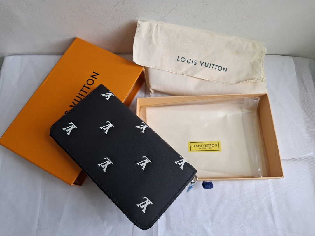 Louis Vuitton Black Monogram Zipped Wallet Box Set (Category: Luxury Bags & Wallets) located in Muntinlupa City. Submitted by iaramos (Listing ID 1468867717, Image 1). Description: - Style: Long zip-around wallet - Design: Black with scattered white LV monogram symbols and silver-tone hardware - Interior: Multiple card slots, spacious compartments, and a secure zippered coin pocket - Condition: Brand new, protective plastic wrap still attached to