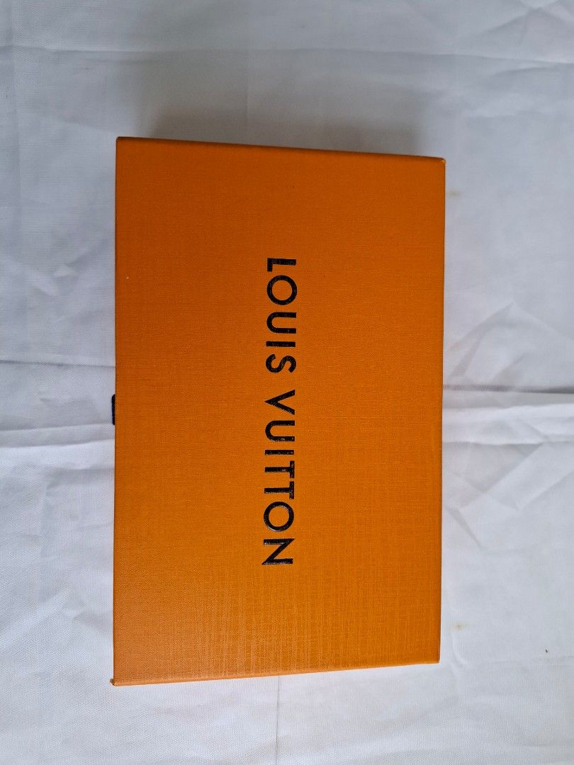 Louis Vuitton Black Monogram Zipped Wallet Box Set (Category: Luxury Bags & Wallets) located in Muntinlupa City. Submitted by iaramos (Listing ID 1468867717, Image 2). Description: - Style: Long zip-around wallet - Design: Black with scattered white LV monogram symbols and silver-tone hardware - Interior: Multiple card slots, spacious compartments, and a secure zippered coin pocket - Condition: Brand new, protective plastic wrap still attached to