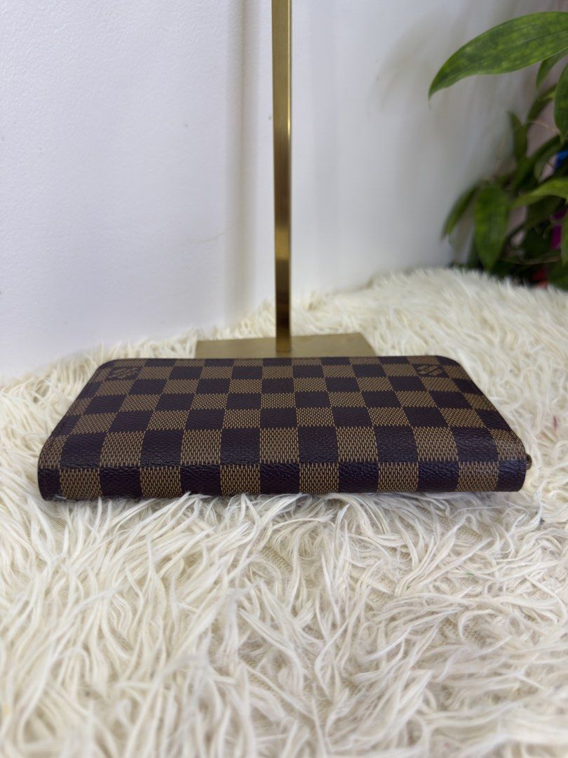 Louis Vuitton Damier Ebene Zippy Wallet (Category: Luxury Bags & Wallets) located in Consolacion. Submitted by naome1. (Listing ID 1468877290, Image 3). Description: - Authentic qualy Louis Vuitton Zippy Wallet in Damier Ebene canvas bale from japan - Classic brown checkered pattern with polished gold-tone hardware - Secure zip-around closure with a smooth-running zipper - Clean interior and exterior - Features multiple card slots, bill compartme