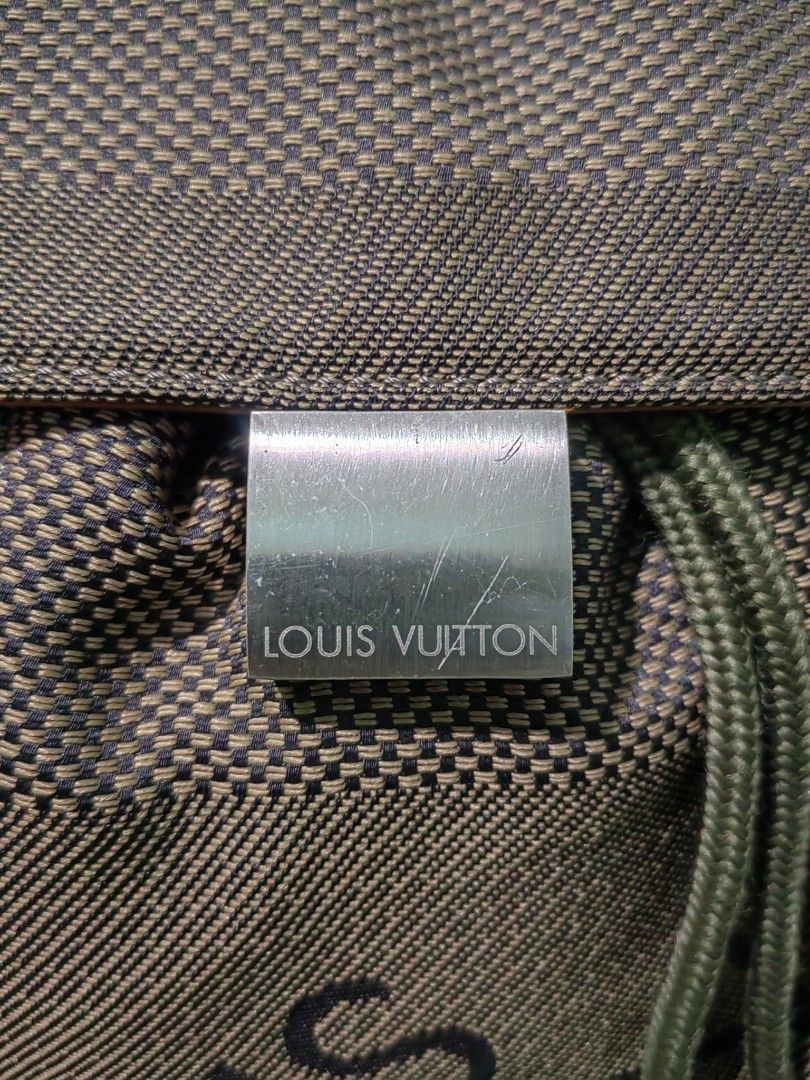 Louis Vuitton Green Monogram Mini Lin Canvas Backpack (Category: Backpacks) located in Las Pinas. Submitted by huslerz (Listing ID 1468818162, Image 3). Description: - Louis Vuitton mini lin canvas backpack in olive green - Bold large printed logo on the front pocket - Secure drawstring closure with flap top and metal clasp buckle - Convenient side zip pocket with branded hardware - Premium tan leather trim and sturdy top handle - Comes with an o
