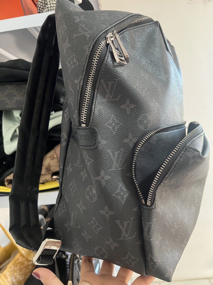 Louis Vuitton Monogram Eclipse Discovery Backpack (Category: Backpacks) located in Muntinlupa City. Submitted by armendaber03743 (Listing ID 1468768549, Image 3). Description: Monogram Eclipse canvas backpack, black leather trim. Silver-tone hardware engraved with Louis Vuitton. Front zipped pocket, roomy main compartment with interior pockets. Adjustable shoulder straps with metal sliders. Made in France..