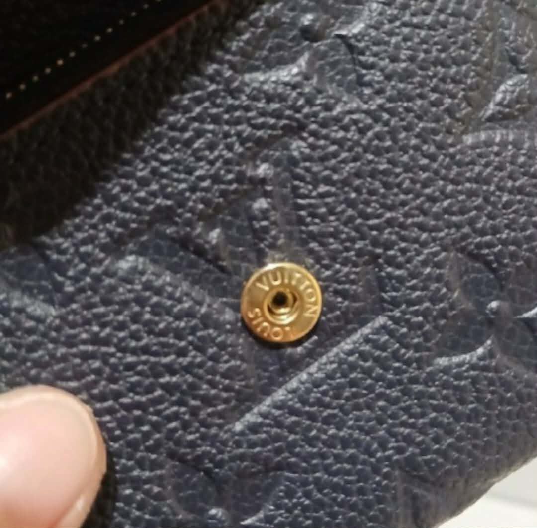 Louis Vuitton Monogram Empreinte Compact Wallet (Category: Luxury Bags & Wallets) located in Manila. Submitted by preloved119 (Listing ID 1468830797, Image 2). Description: - Authentic Louis Vuitton compact wallet - Material: Black Monogram Empreinte leather with gold hardware - Closure: Envelope-style flap with gold snap button - Interior: Card slots and a secure zipped coin compartment - Details: Hot-stamped Louis Vuitton Paris Made in France s