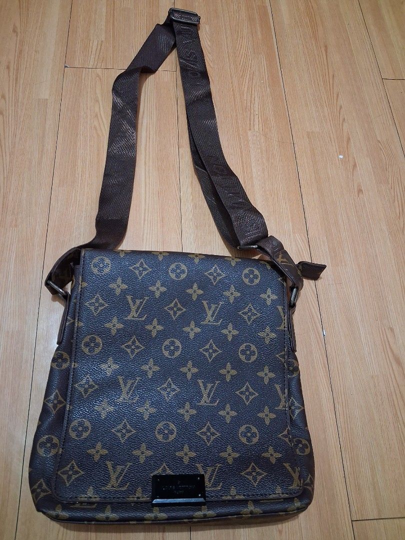 Louis Vuitton Monogram Messenger Bag (Category: Luxury Bags & Wallets) located in Quezon City. Submitted by lydia1127 (Listing ID 1468929577, Image 2). Description: - Authentic Louis Vuitton messenger bag in classic brown monogram canvas - Features a dark brown adjustable nylon strap with repeating LV logo branding - Stylish rectangular metal plaque on the front flap corner - Structured, flat silhouette ideal for a daily carry - Secure zipper clo